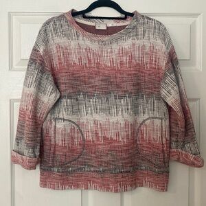 Red / black / cream abstract print sweatshirt top from Anthropologie.